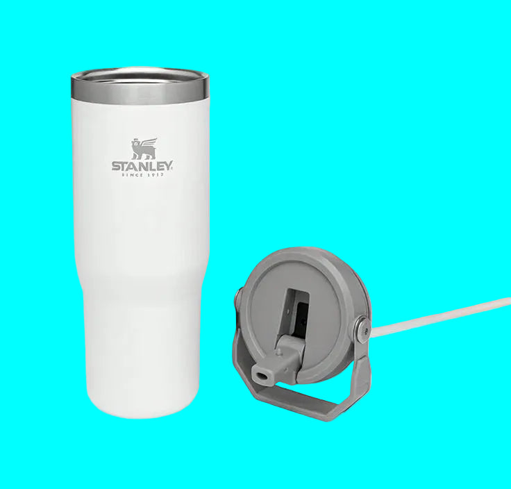 White Stanley tumbler with a gray lid on a white background