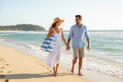Couple on Beach with Light Blue Striped Tote Bag